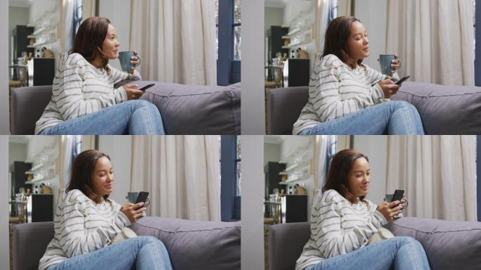 混血女性使用智能手机。隔离期间的社交距离和自我隔离