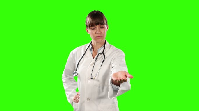 前视图的一个医生握着她的手为一个复印空间与绿色屏幕