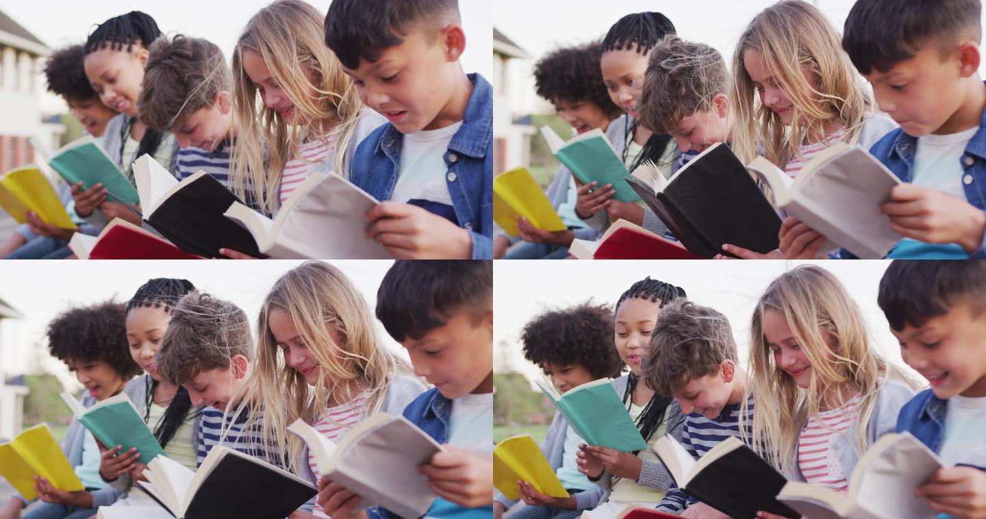 一群孩子在读书儿童快乐阅读草坪上阅读的孩