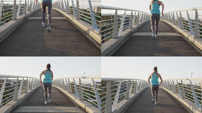 年轻女子在桥上跑步