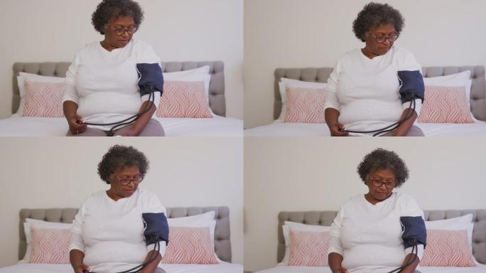 混血妇女在测量血压。隔离期间的社交距离和自我隔离