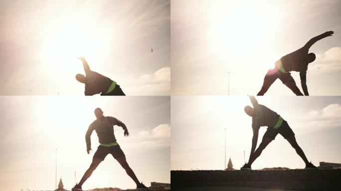 Man performing stretching exercising on the beach