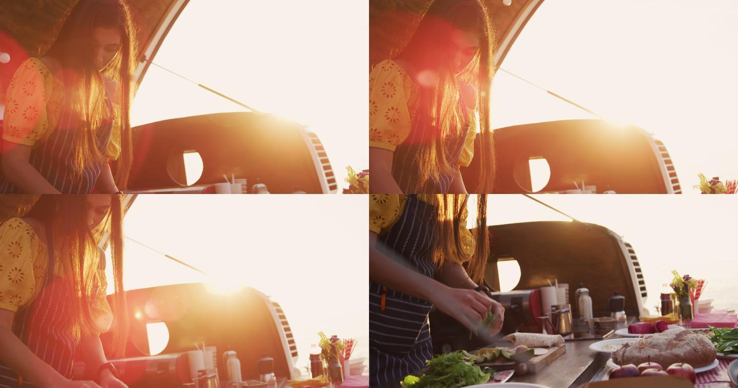 一个年轻女人在外面的餐车里做饭