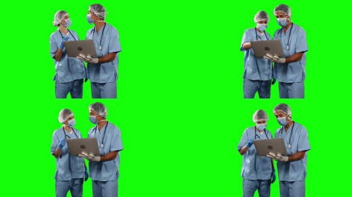 医生在绿色屏幕的笔记本电脑上观看一些结果的正面视图