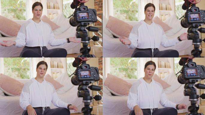 Caucasian blogger woman doing a video at home