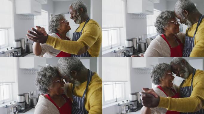 一对非裔美国老年情侣在家跳舞。隔离期间的社交距离