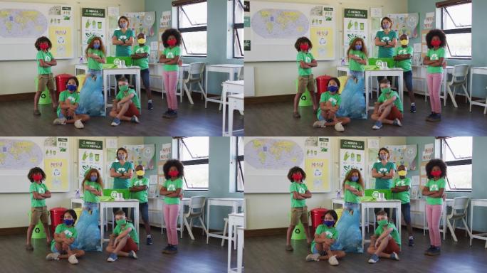 女老师和一群穿着回收标志t恤的孩子在课堂上