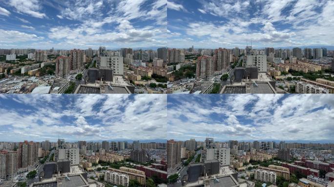 广角下的蓝天白云和城市建筑群