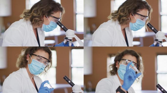 女教师戴口罩和防护眼镜在实验室使用显微镜