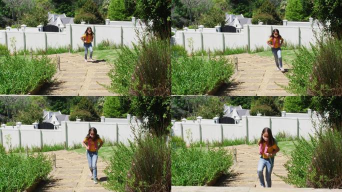 白人女孩戴着口罩背着背包站在家里的花园里