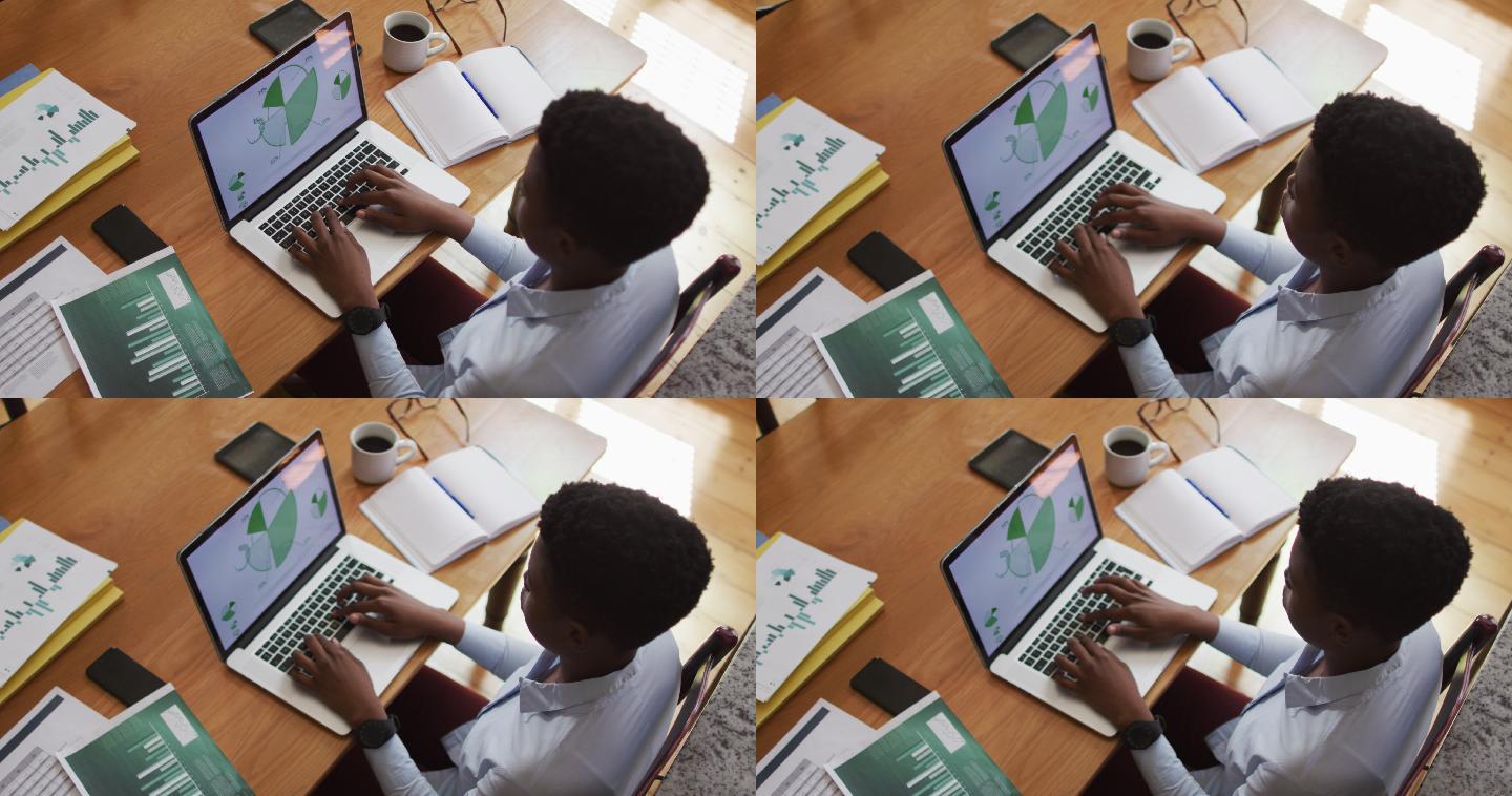 头顶上的非洲裔美国妇女使用笔记本电脑在家里工作
