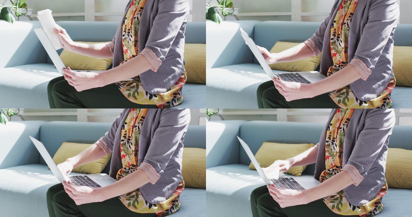 一个女人正用纸巾擦拭她的笔记本电脑