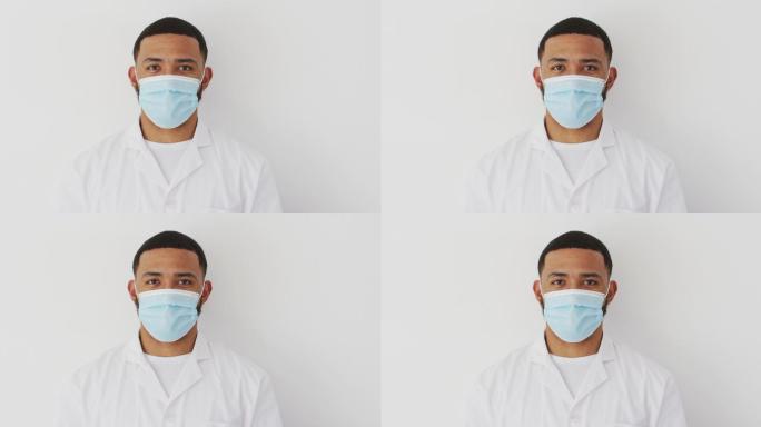 戴面罩的男性卫生工作者，背景为白色