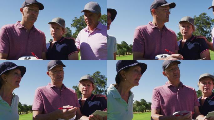 白种老夫妇在高尔夫球场的记分卡上讨论和写高尔夫得分