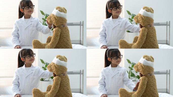 装扮成医生的小女孩给玩具小熊看病