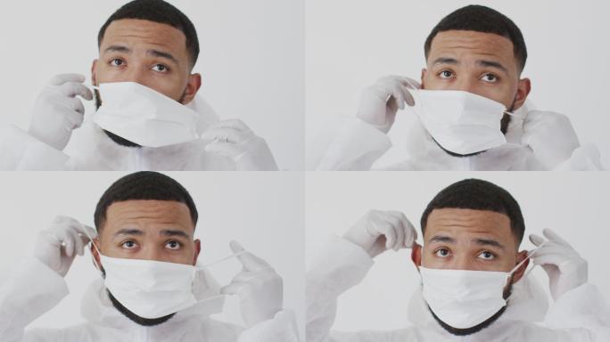 男性卫生工作者戴着面罩，背景为白色