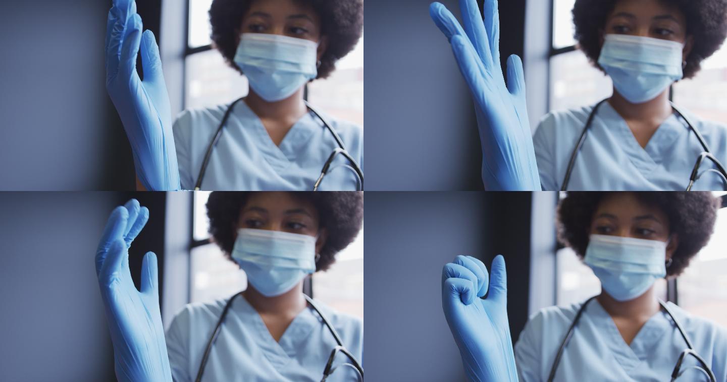 混合种族女医生戴口罩戴上防护手套