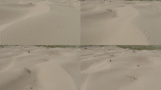 徒步沙漠的人航拍沙漠环境恶化风沙