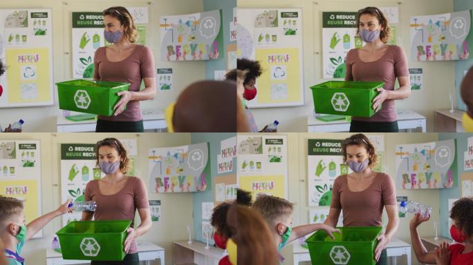 一群戴着口罩将塑料物品放入回收容器的孩子