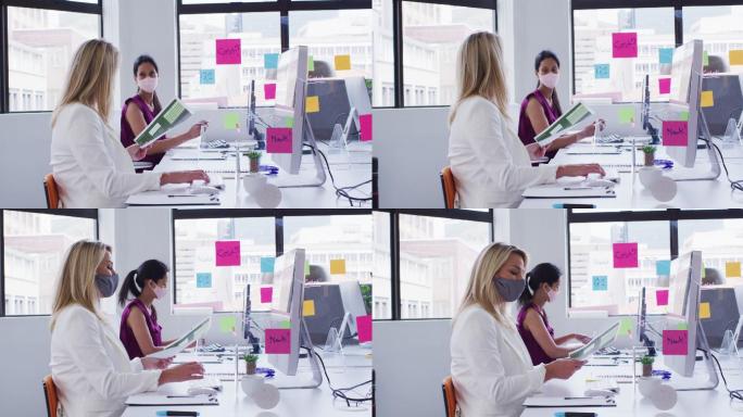 各式各样的女商人戴着口罩在办公室里用电脑处理文书工作
