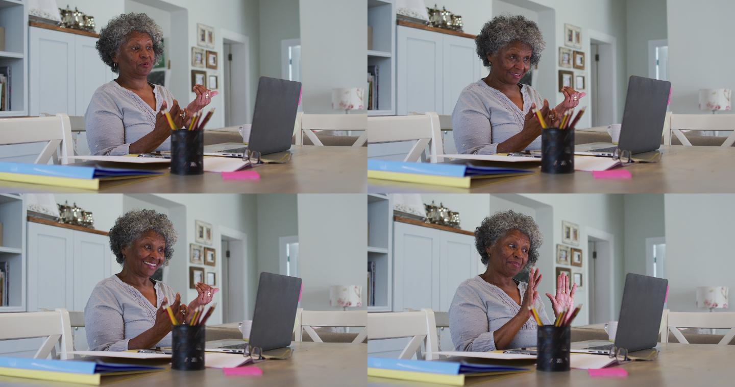 高级非洲裔美国人在家里用笔记本电脑视频聊天