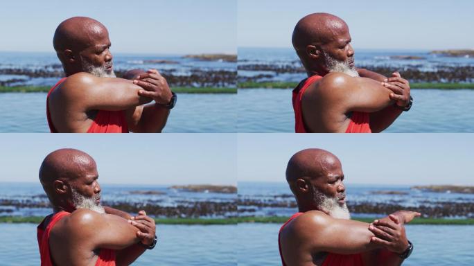 资深非洲裔美国人在海边的岩石上锻炼