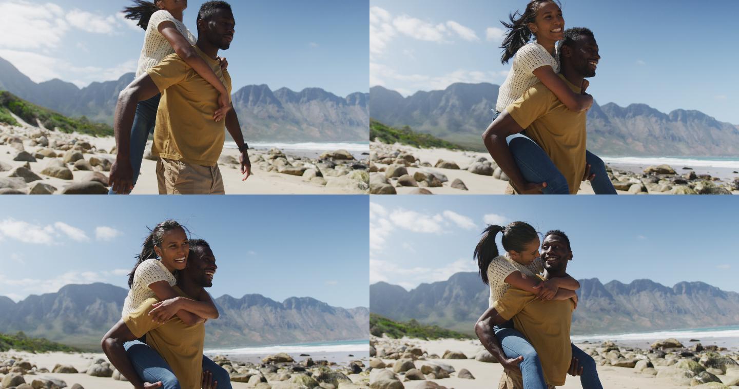 一个非裔美国人在海滩上背着他的妻子