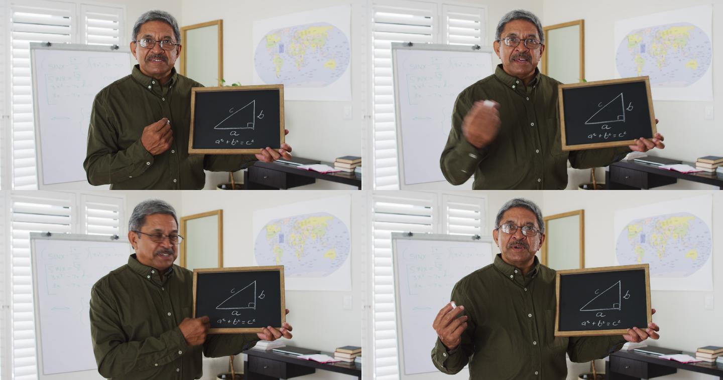 混血男教师站在白板前给摄像机上在线课程