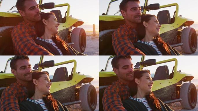 幸福的白人夫妇坐在沙滩车在海边聊天拥抱