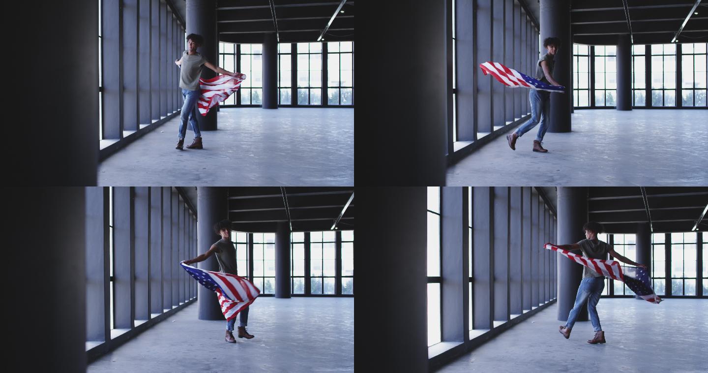 非裔美国人手持美国国旗在空荡荡的停车场跳舞