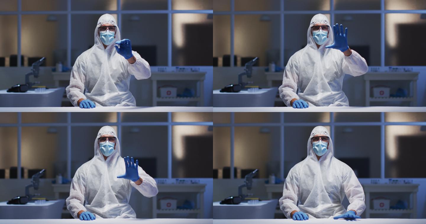 白人男性医务工作者，穿着防护服，戴着口罩，使用虚拟数字接口