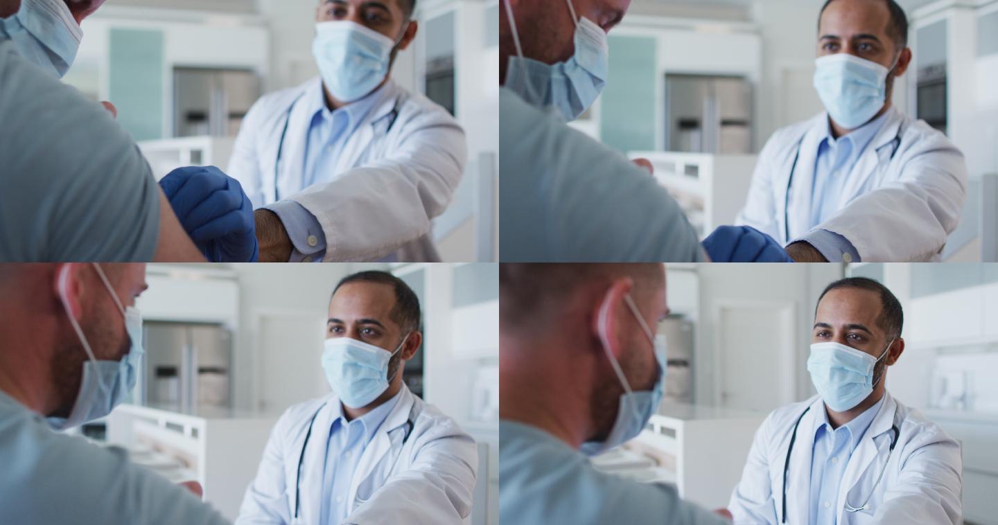 混血男医生戴着口罩在家给男性病人接种疫苗