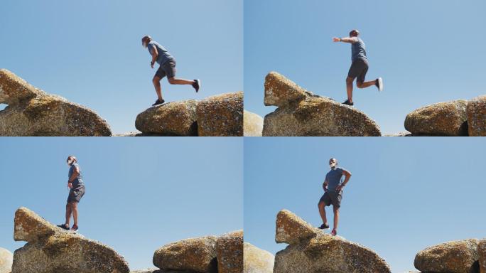 非裔美国老年人在海边的岩石上锻炼跑步