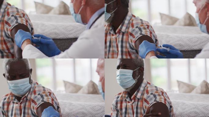 资深白人男性医生为资深非洲裔美国人接种疫苗在家都戴着口罩