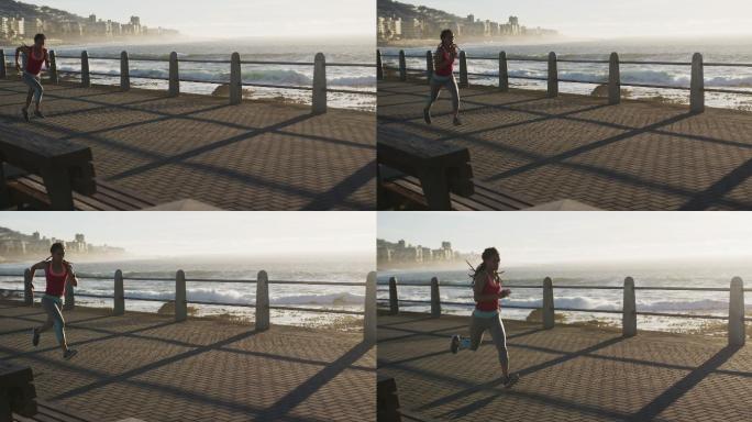 非裔美国妇女在日落时在海边散步