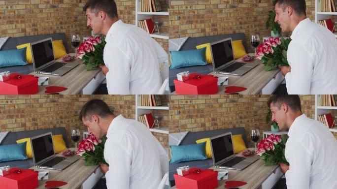 白人男子用笔记本电脑打视频电话手捧鲜花，飞吻
