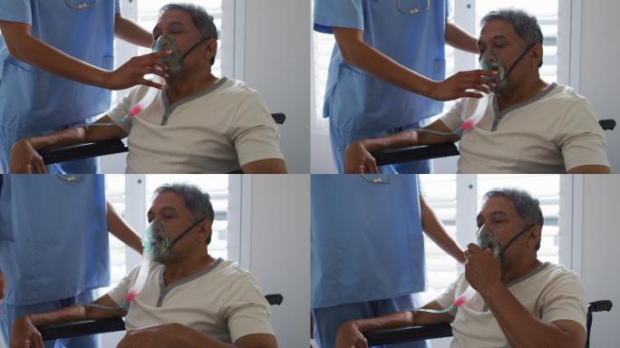 混血女医生在家中协助老年男子使用呼吸机