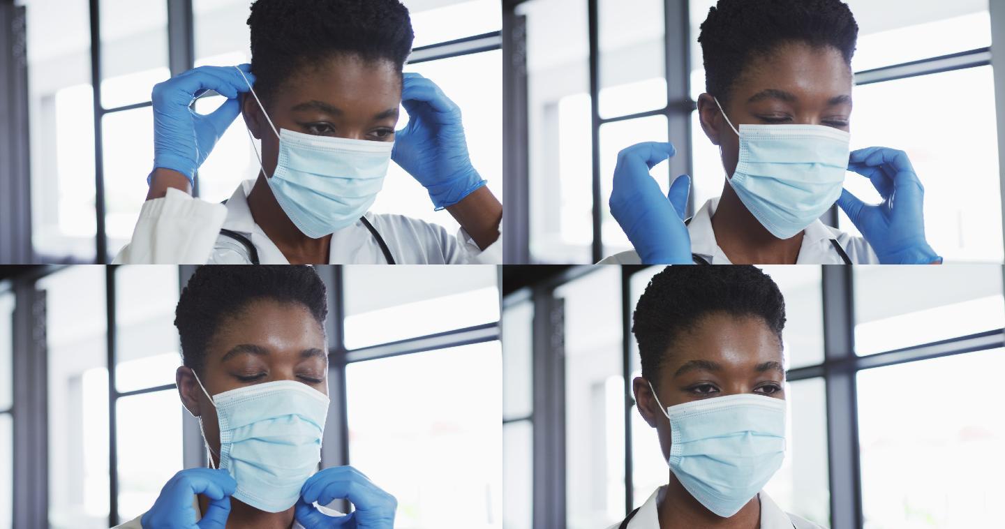 非裔美国女医生戴着外科手套戴着口罩的肖像