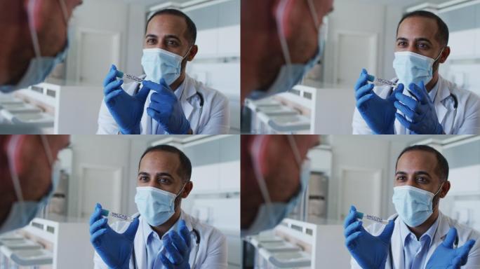 混血男医生戴口罩前在家咨询男患者接种疫苗