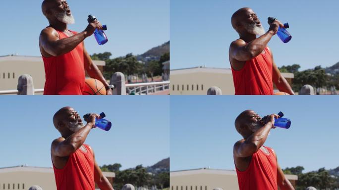高级非洲裔美国人与篮球饮用水在球场附近的海滩