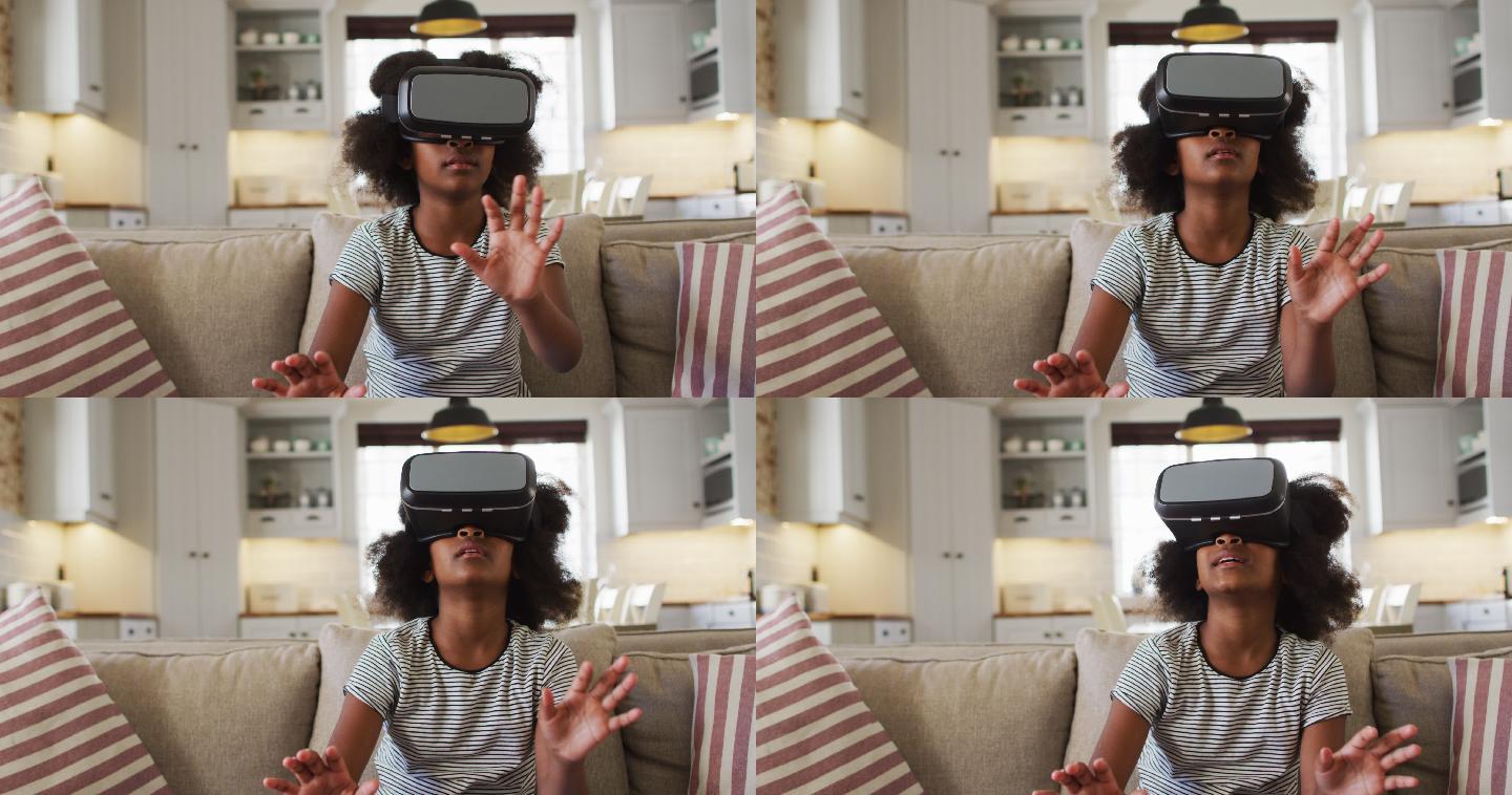 非裔美国女孩坐在沙发上，戴着虚拟现实头盔