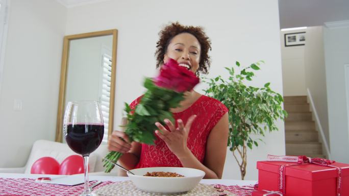 Happy mixed race woman on a valentines date video 