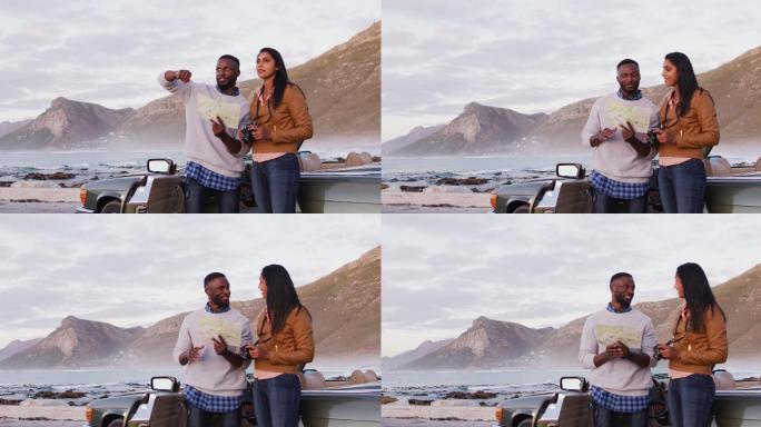 African american couple using map for directions w