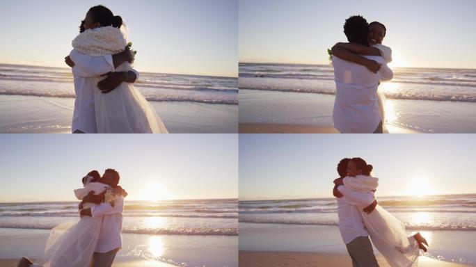 一对非裔美国情侣在夕阳西下的海滩上拥抱结婚