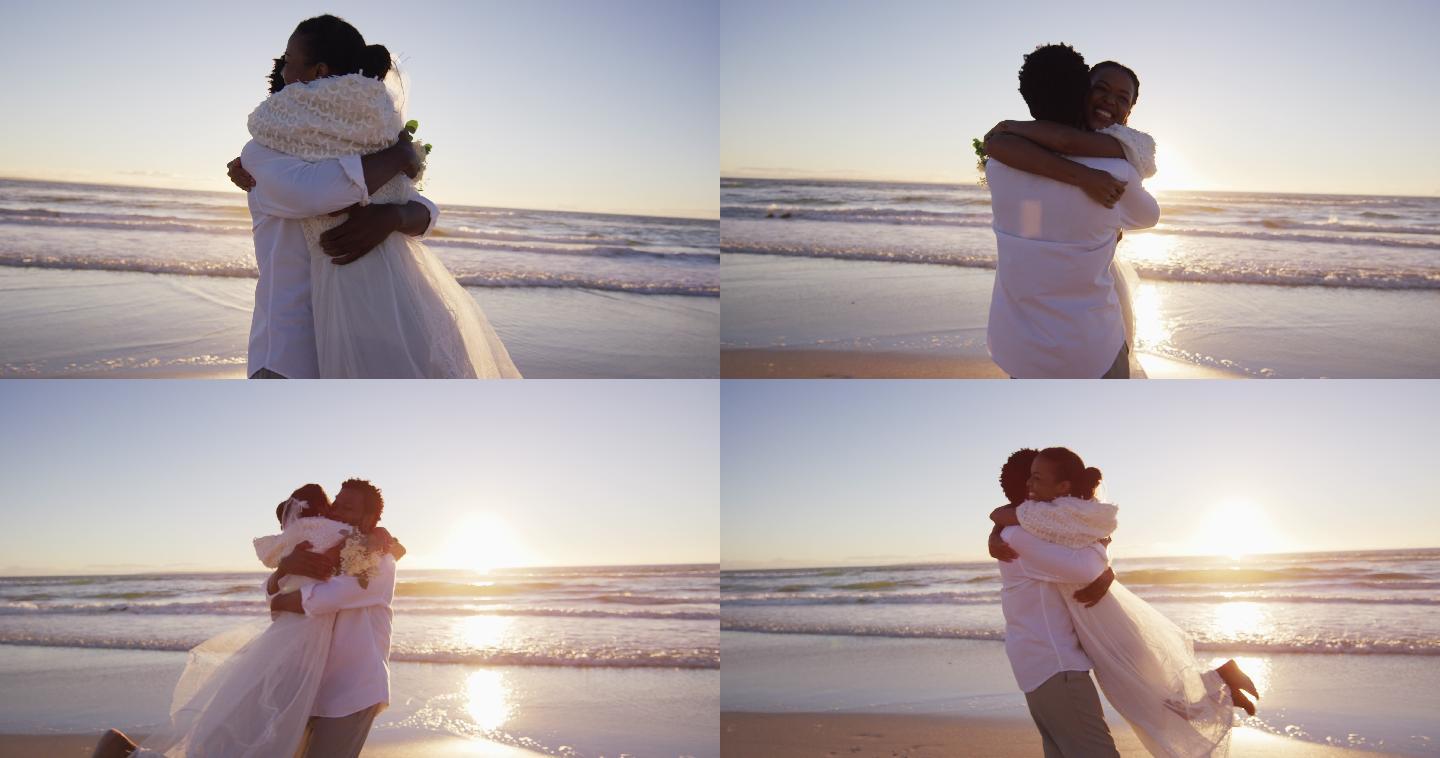 一对非裔美国情侣在夕阳西下的海滩上拥抱结婚