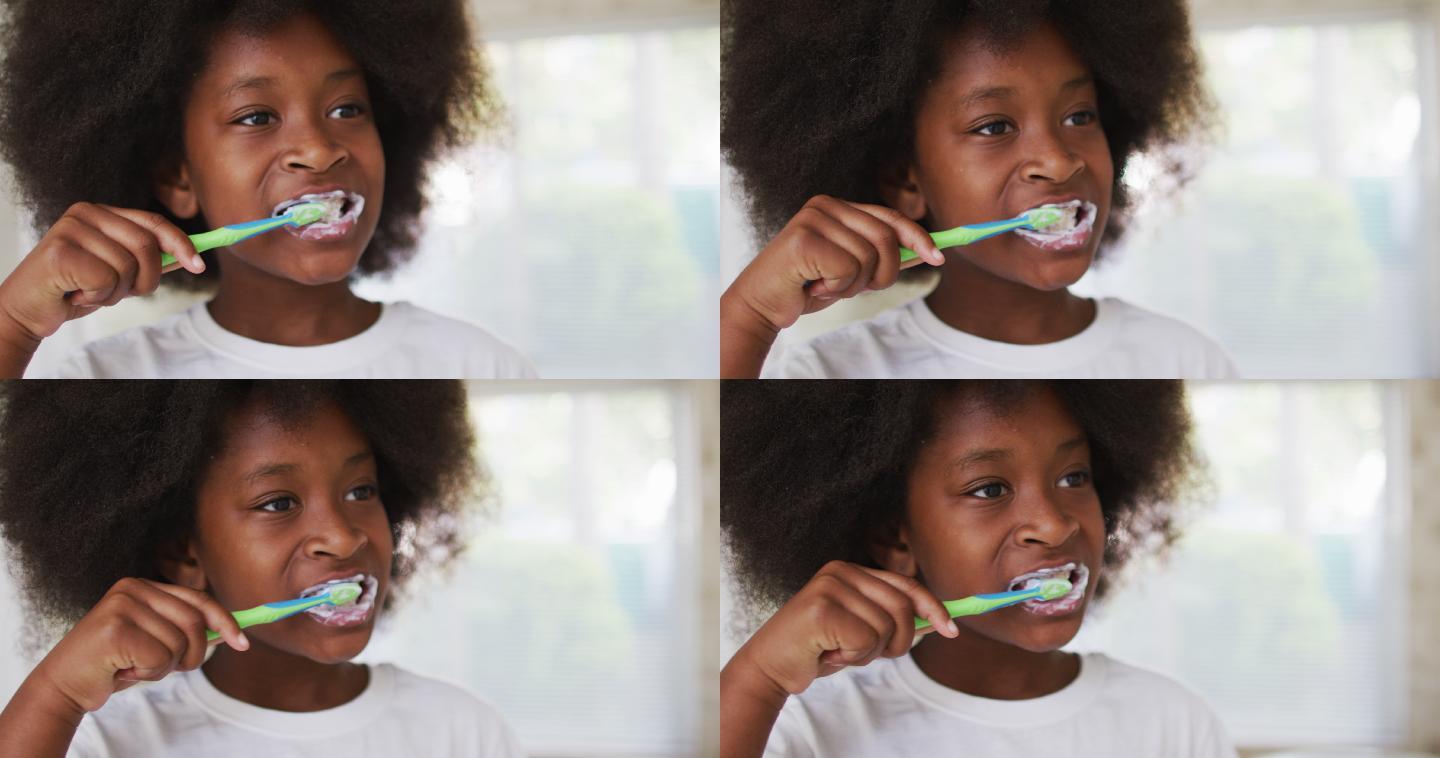 一个非裔美国女孩在浴室里刷牙