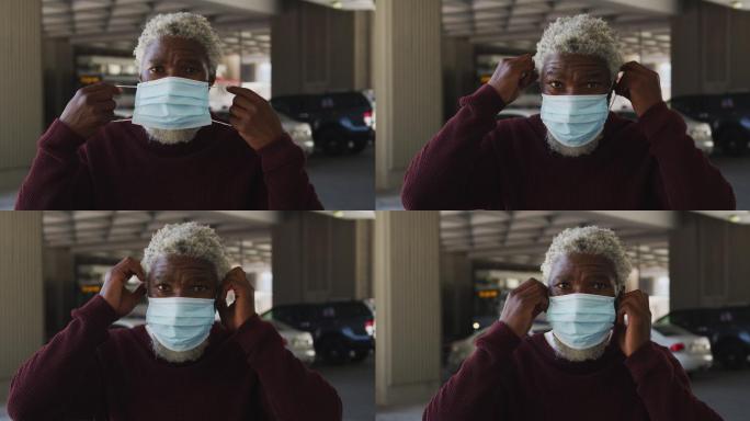 非洲裔美国老人在停车场戴口罩的肖像