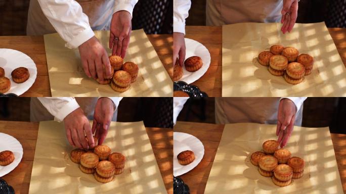 厨师包装月饼实拍月饼与茶壶摆拍特写中秋节