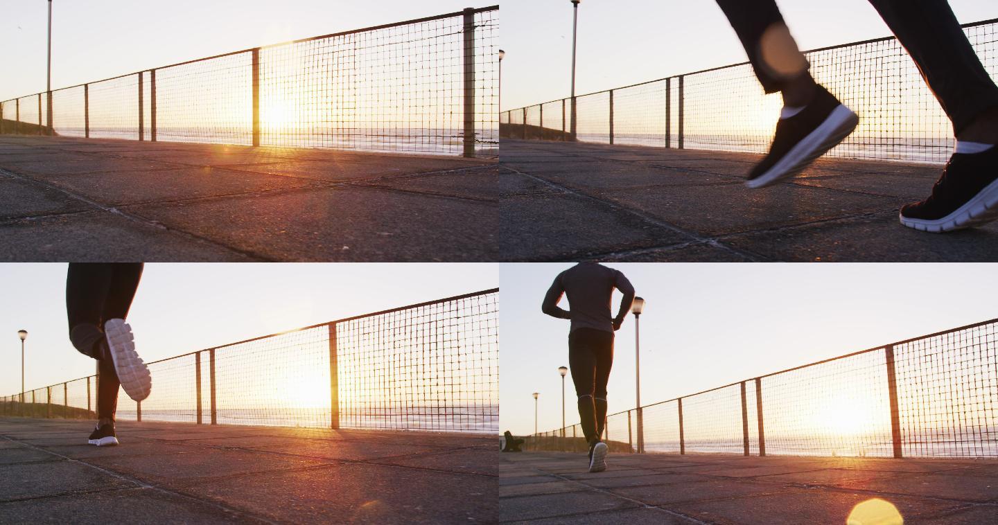 非裔美国人在户外锻炼，日落时在海边跑步
