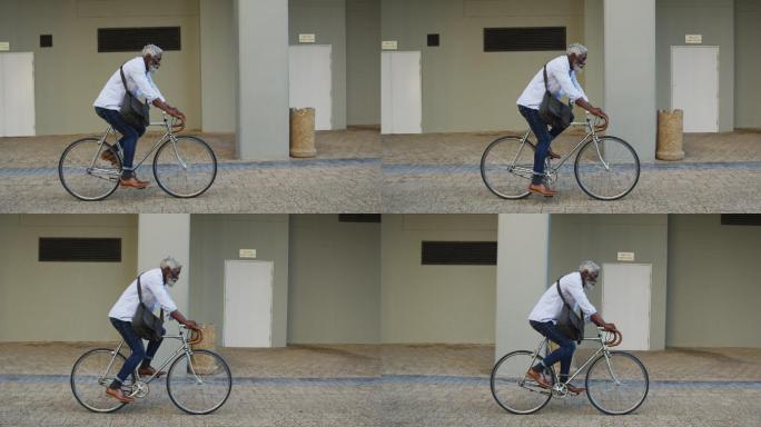 非裔美国老人在公司园区骑自行车